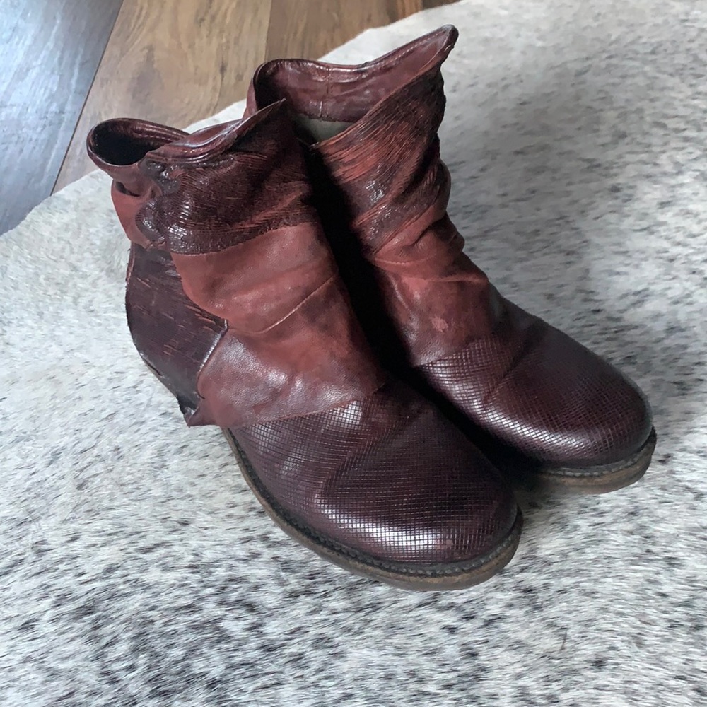 Merlot color, worn a few times, but look brand new